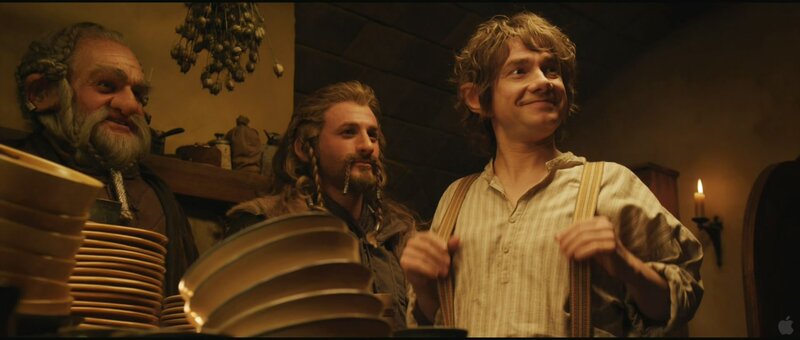 Bilbo and dwarves in a tavern