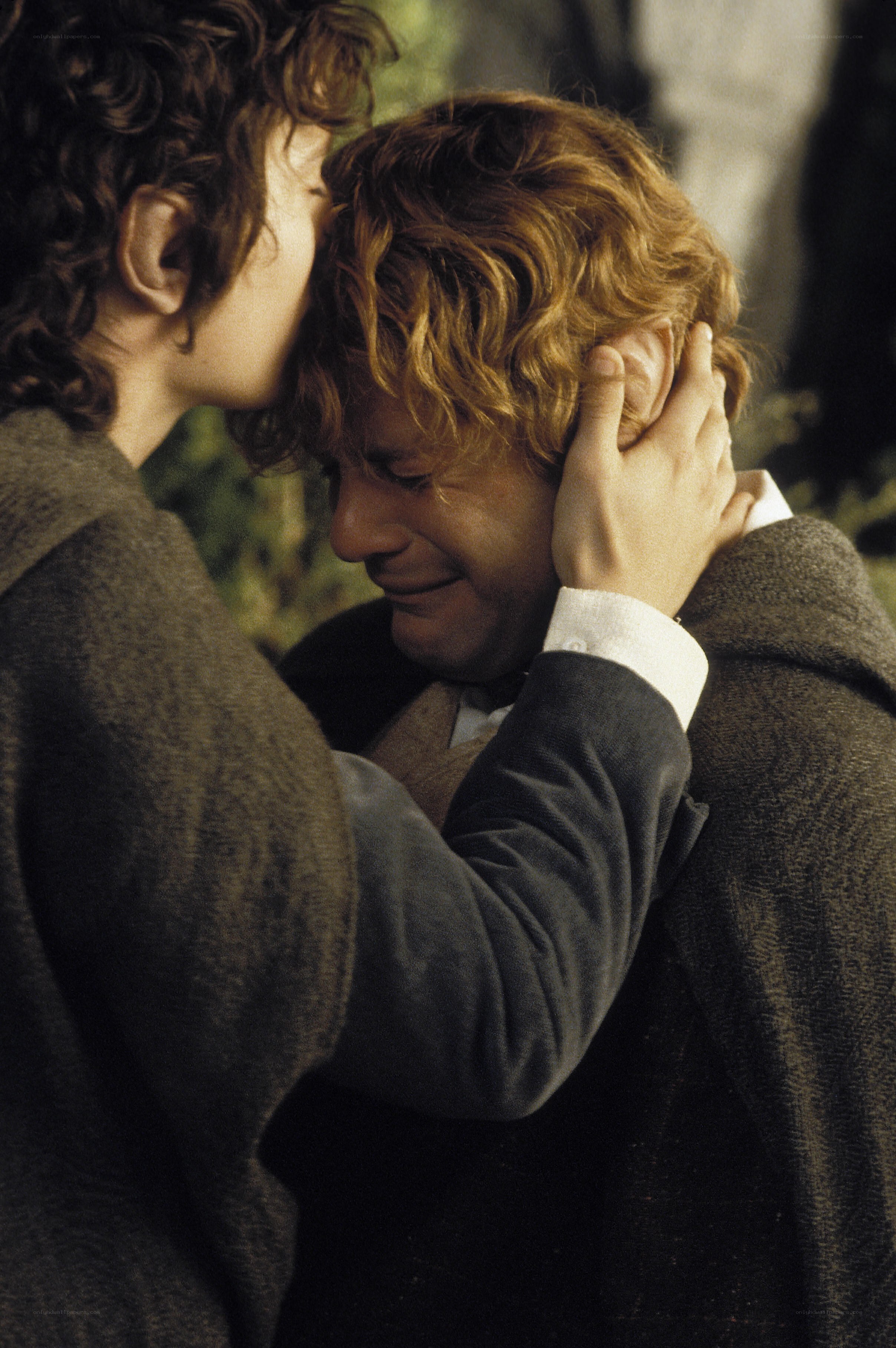Bilbo and Frodo embrace