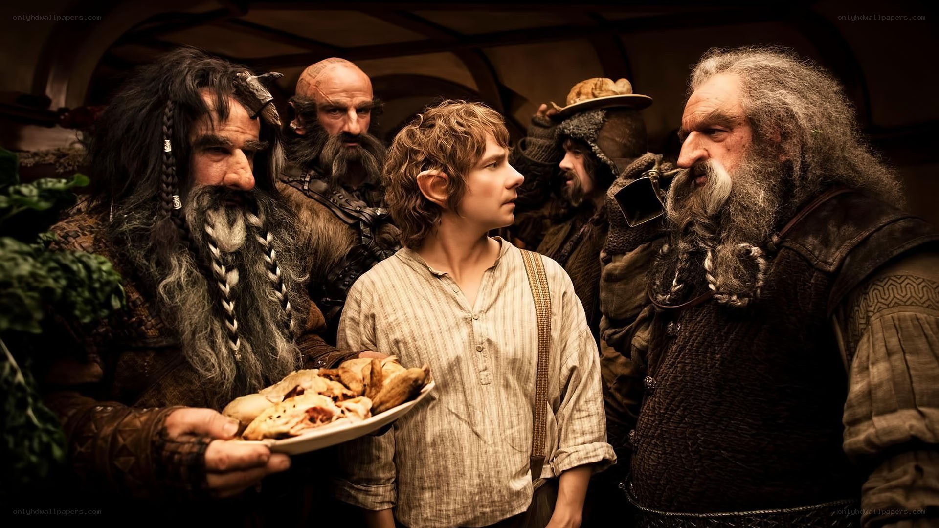 Bilbo and the dwarves in a hall