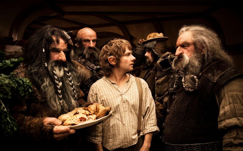 Bilbo and the dwarves in a tavern