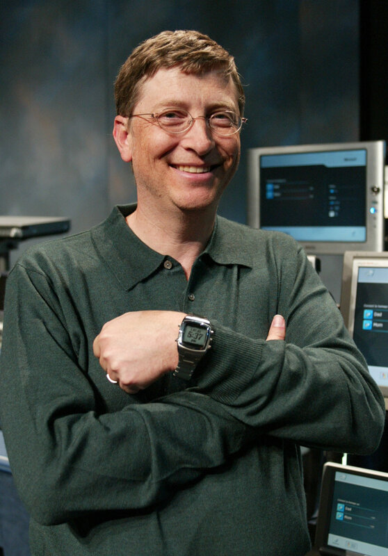 Bill Gates smiling at computers