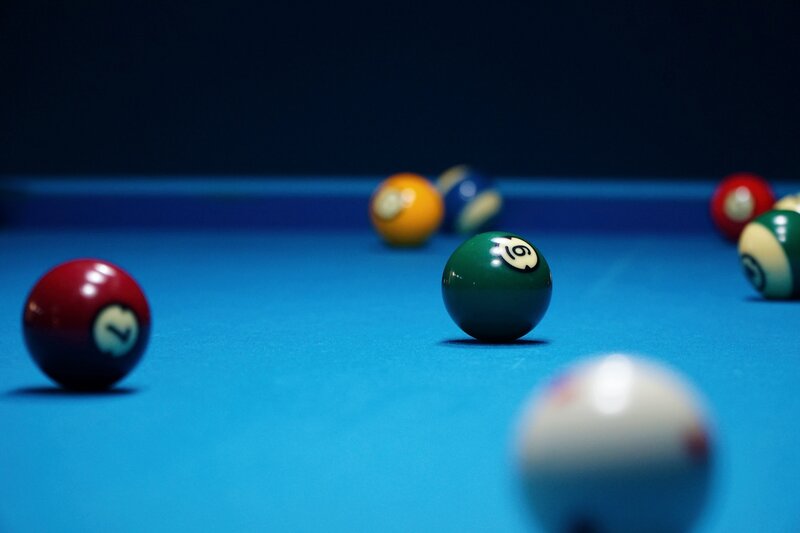 Billiard balls on a pool table