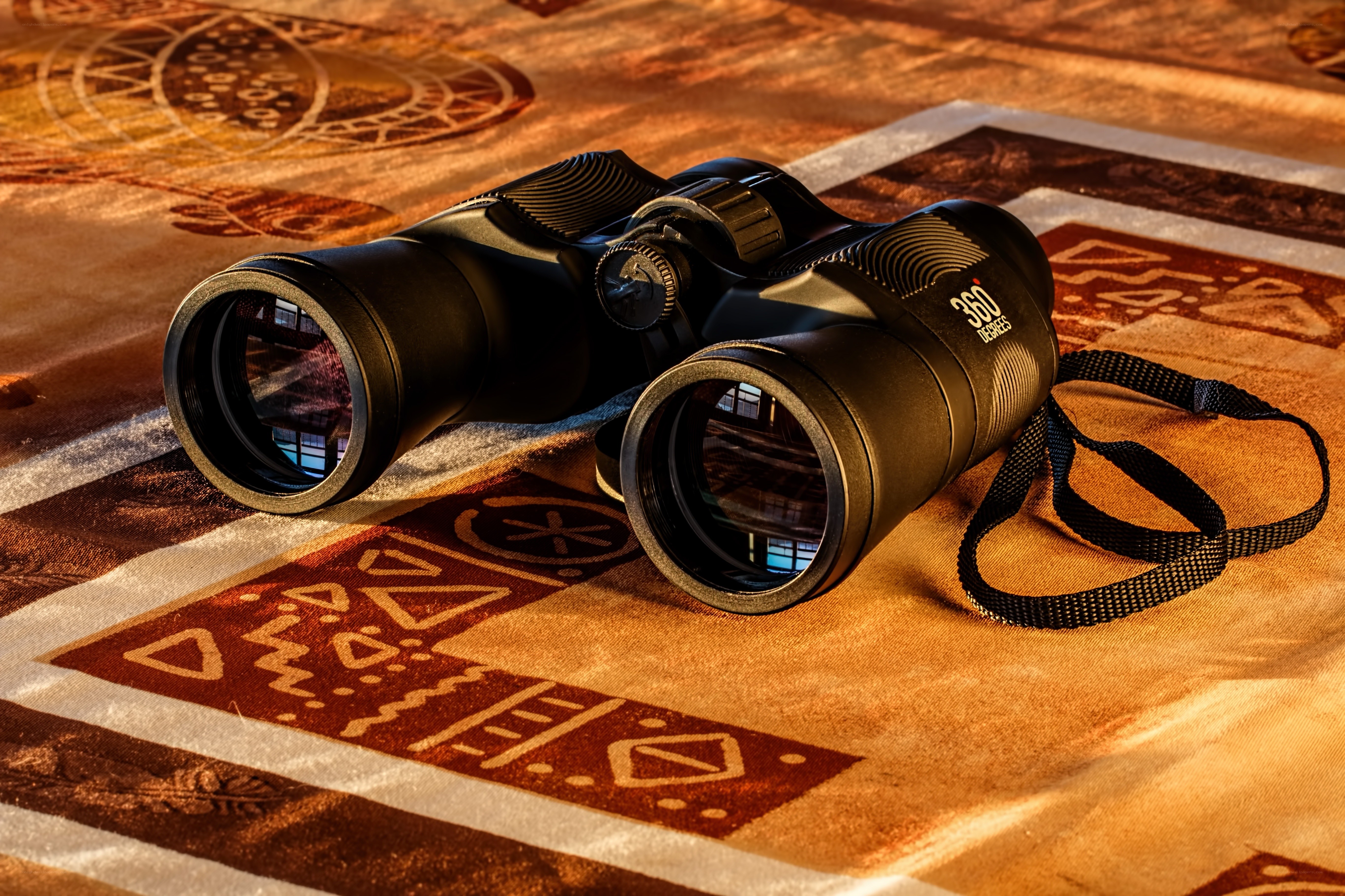 Binoculars on patterned fabric