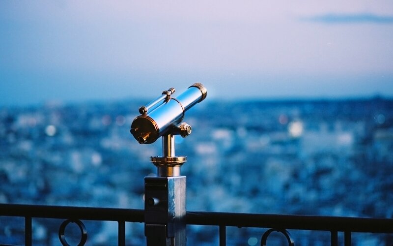 Binoculars overlooking a city