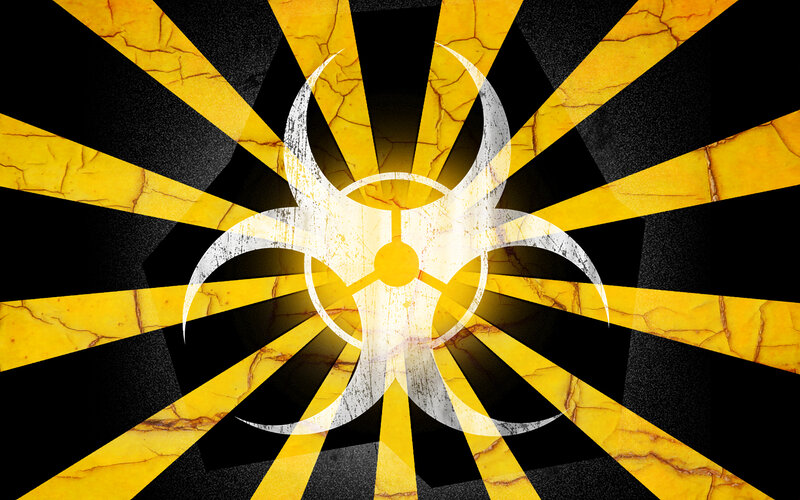 Biohazard symbol on cracked background