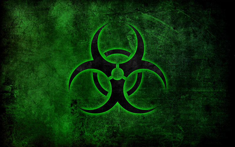 Biohazard symbol on green background