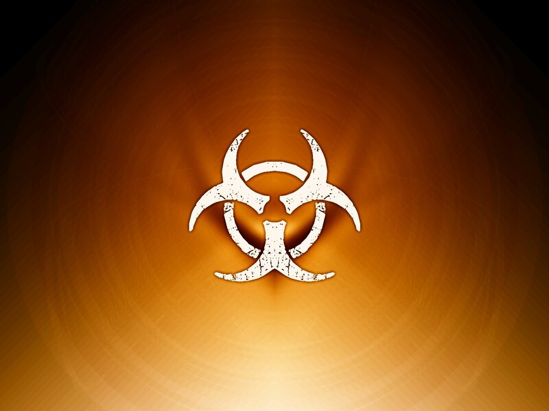 Biohazard symbol on orange background