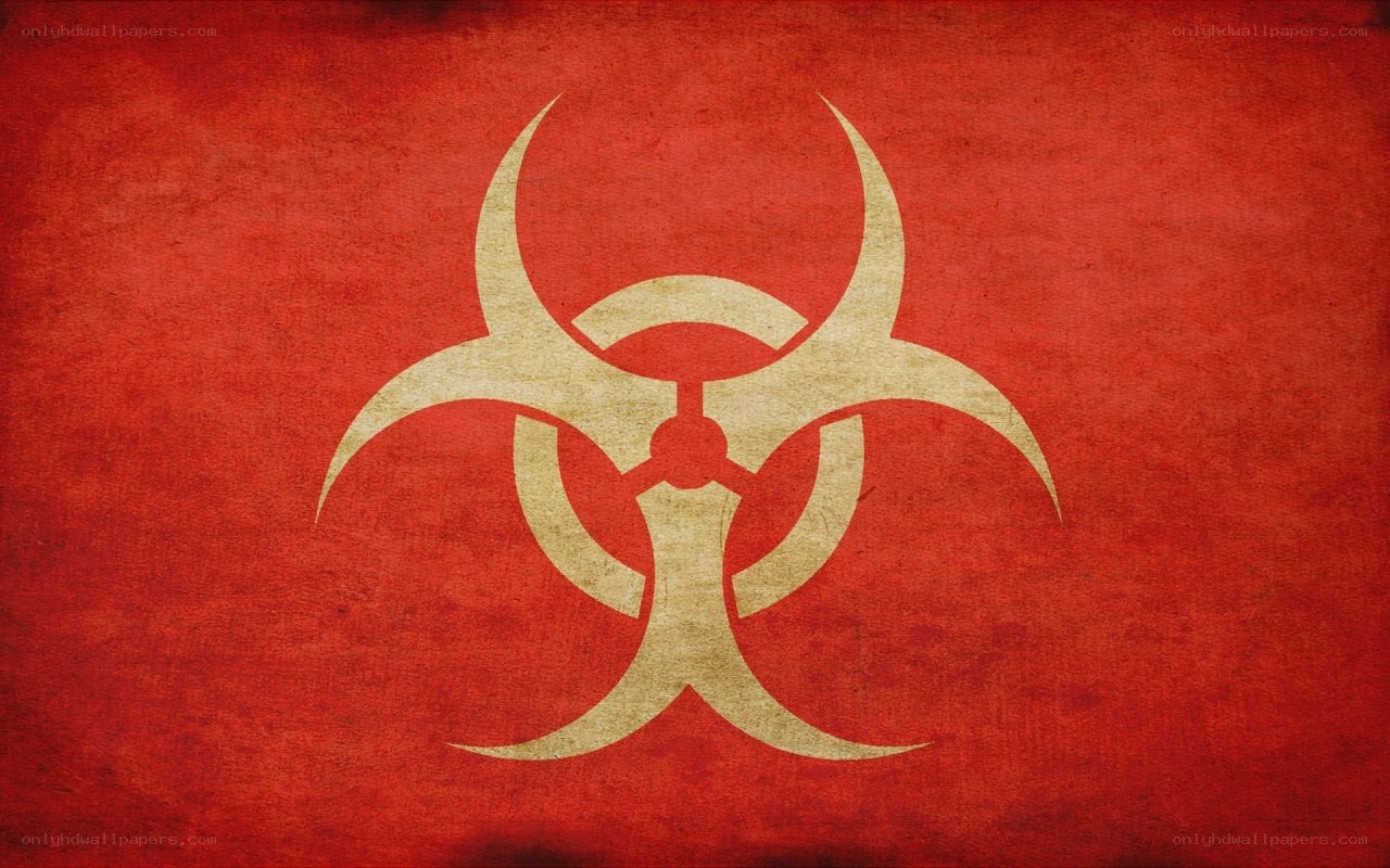 Biohazard symbol on red background