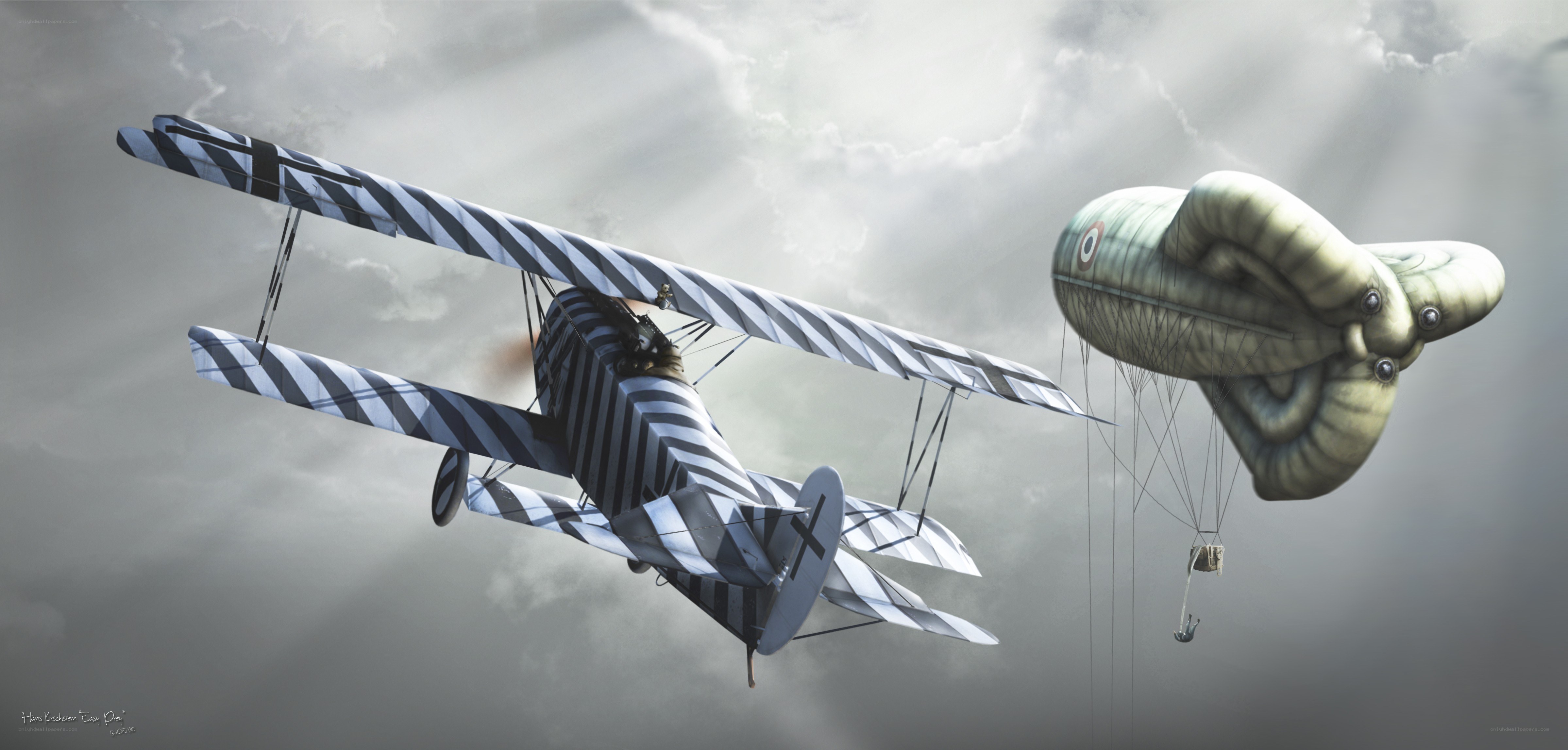Biplane attacking barrage balloon