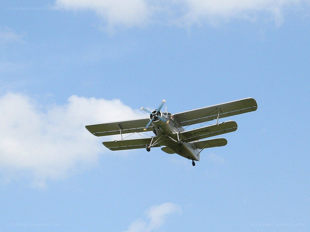 biplane flying in the sky