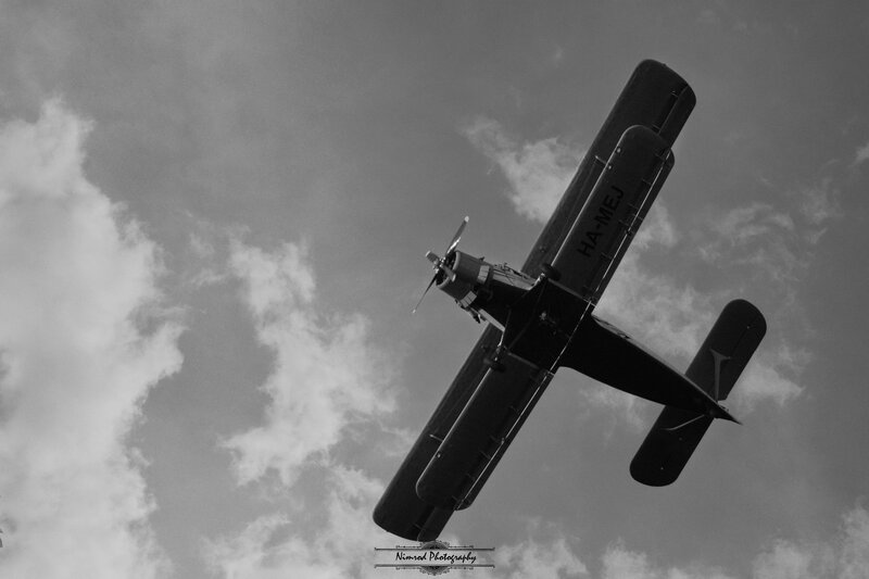 Biplane in Flight — Black, Dramatic