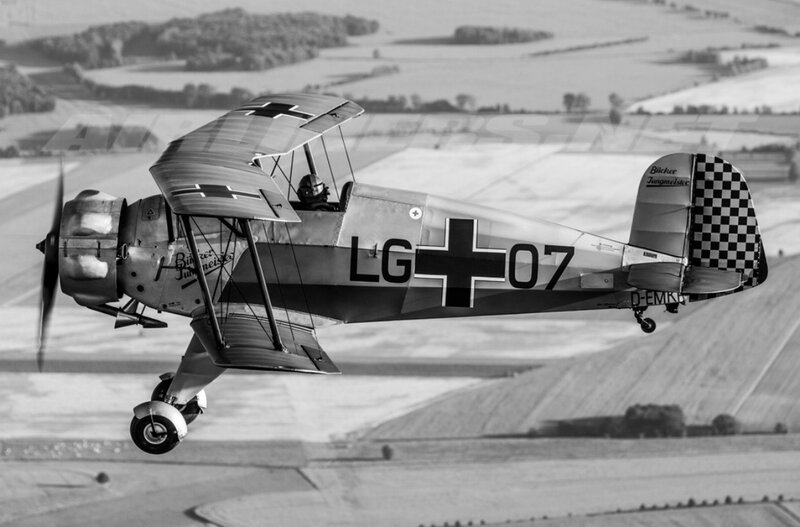 Biplane in Flight — Black, Dynamic, Afternoon