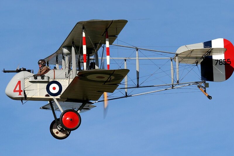 Biplane in Flight — Blue, Dynamic, Afternoon, Photograph, Pilot