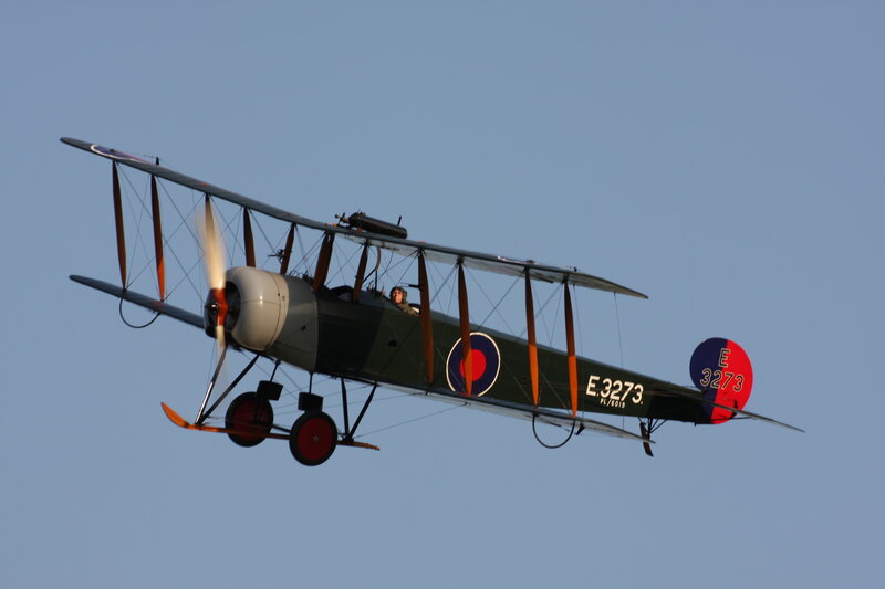 Biplane in Flight — Blue, Serene, Afternoon
