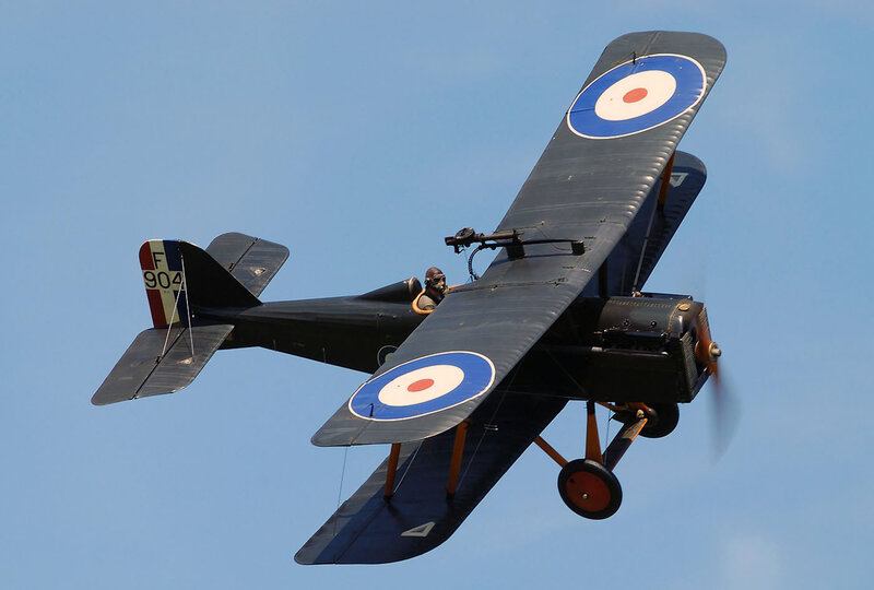 Biplane in Flight — Blue