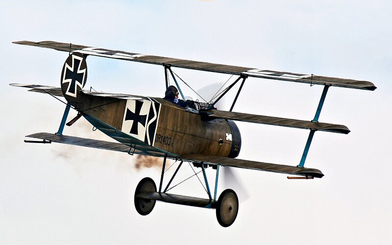 Biplane in Flight — Brown