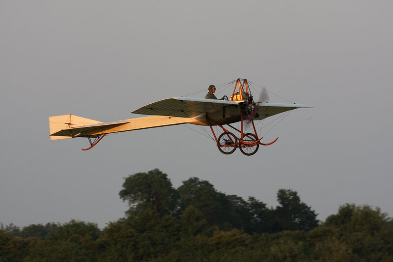 Biplane in Flight — Gray, Calm, Sunset