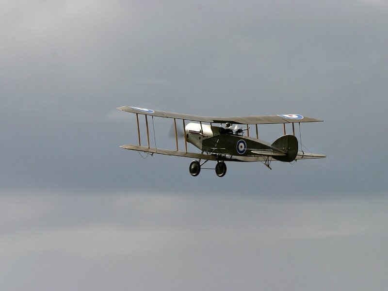 Biplane in Flight — Gray, Overcast