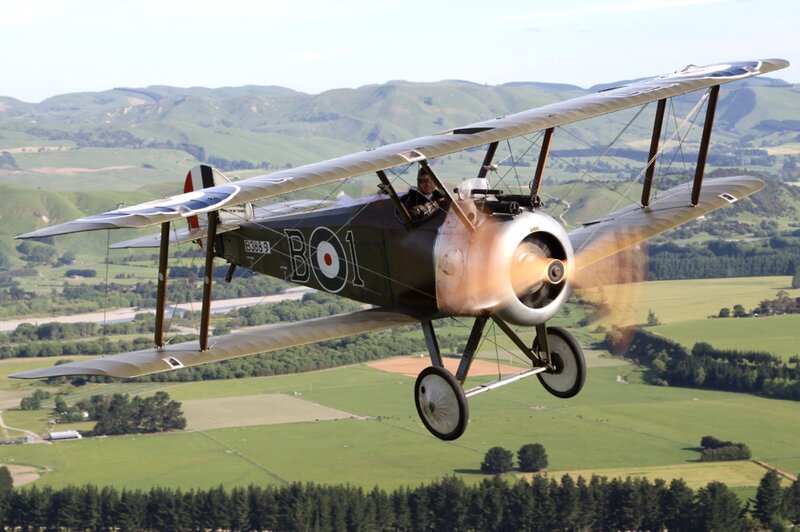 Biplane in Flight — Green, Serene, Afternoon