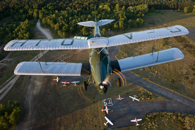 Biplane in Flight — Green, Serene, Sunset