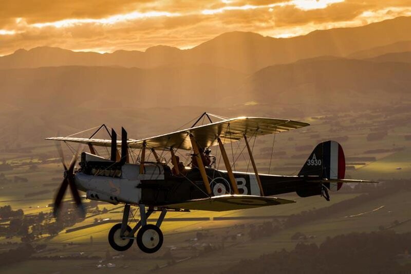 Biplane in Flight — Orange