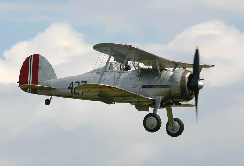 Biplane in Flight — Silver