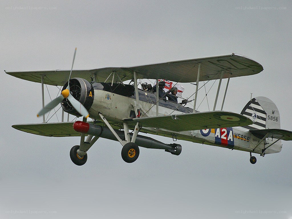 Biplane in flight with crew