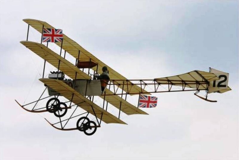 Biplane in Flight — Yellow