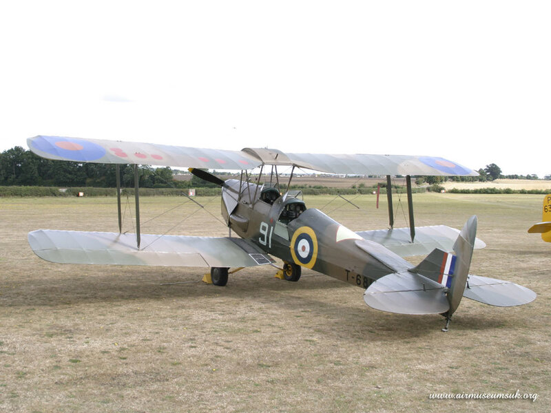 biplane on a grass field