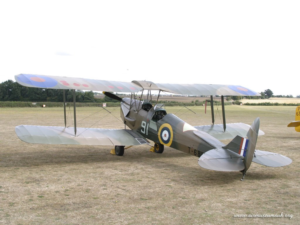 biplane on a grass field