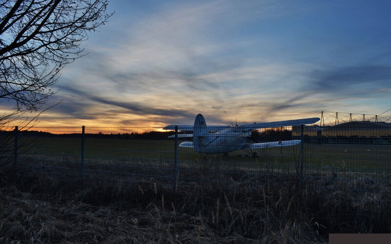 Biplane on Airfield — Blue
