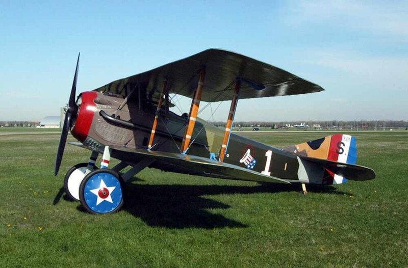 Biplane on Grass Field — Green, Calm