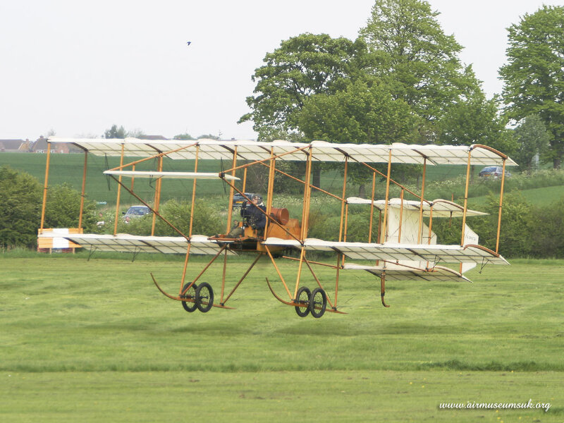 biplane on grass field