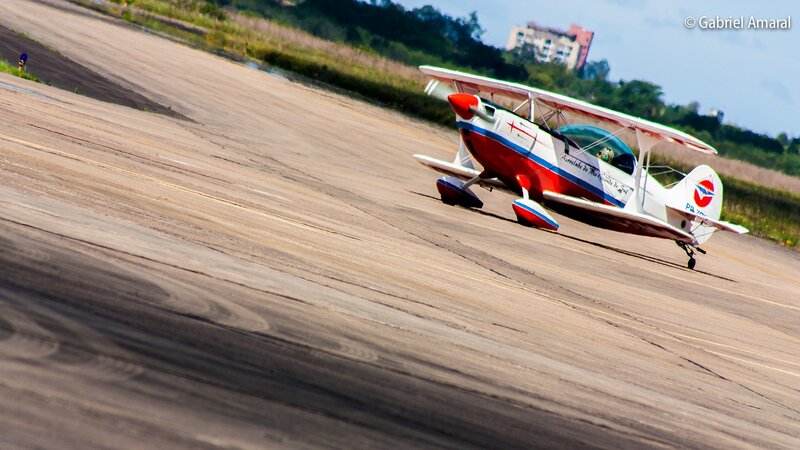 Biplane on Runway — White, Dynamic