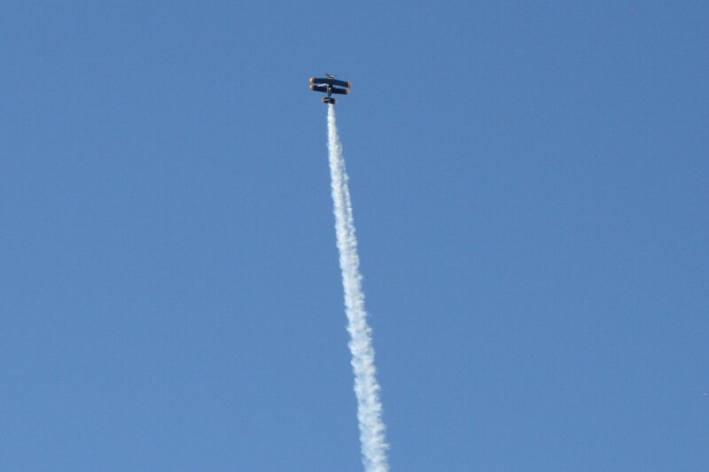 Biplane Performing Aerobatic — Blue