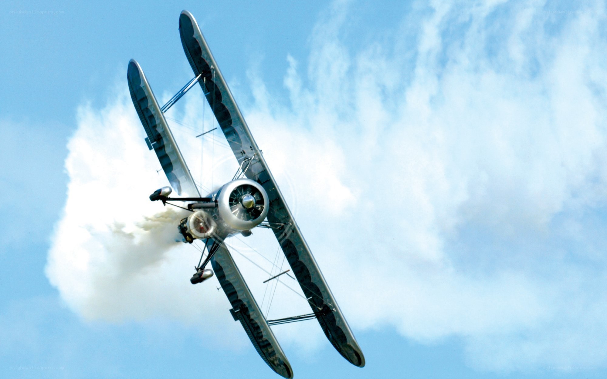 Biplane performing aerobatic maneuver
