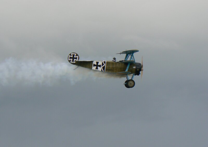 biplane performing aerobatic maneuver