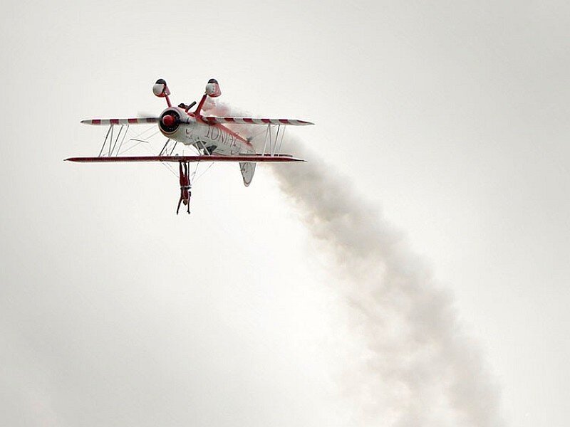 Biplane performing aerobatic stunt