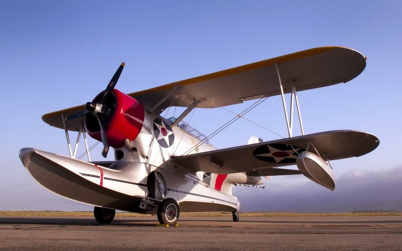 Biplane Seaplane on Tarmac — White