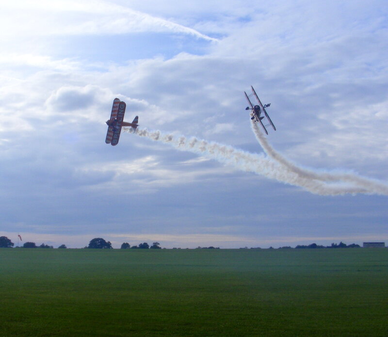 Biplanes performing aerobatics