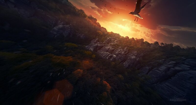 Bird flying over mountain at sunset