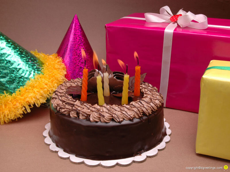 Birthday cake with candles and gifts