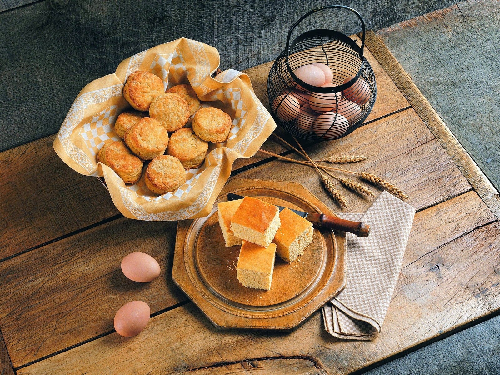 Biscuits and cornbread on a wooden table