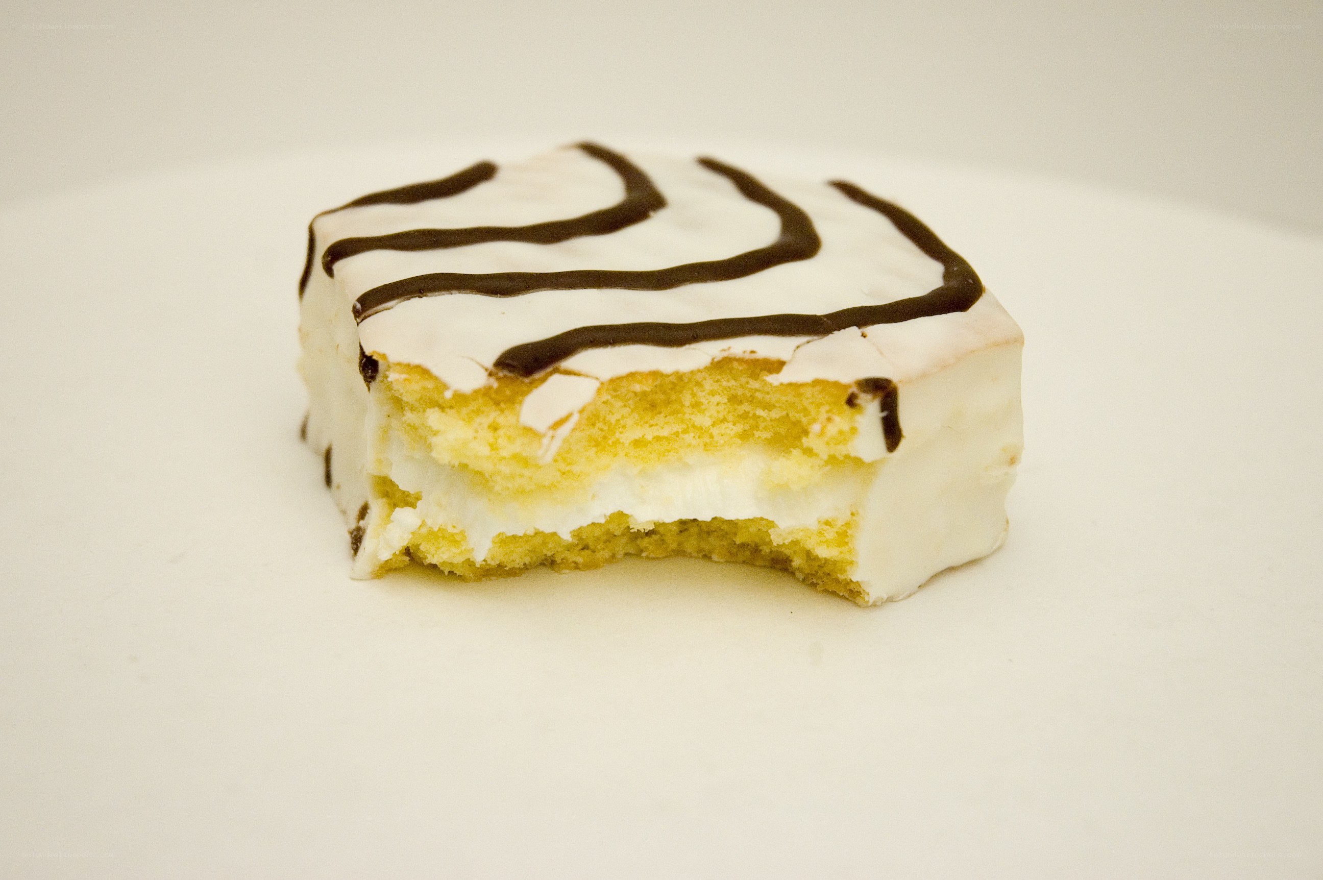 bitten cake slice with icing