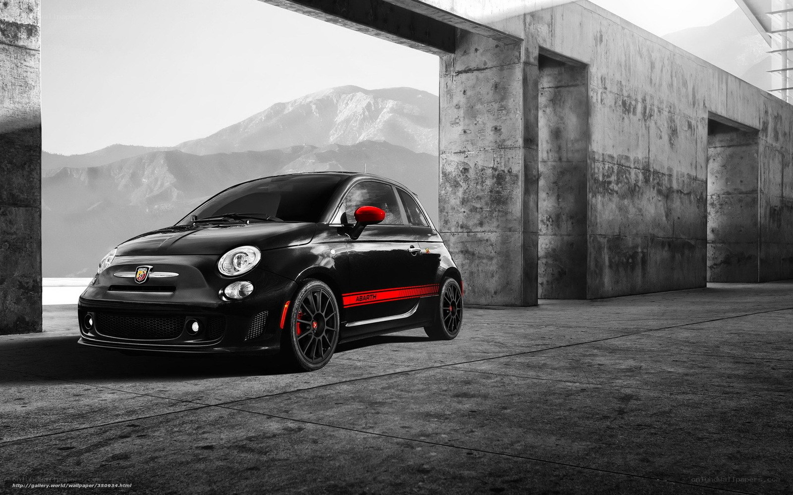 Black Abarth car in concrete structure