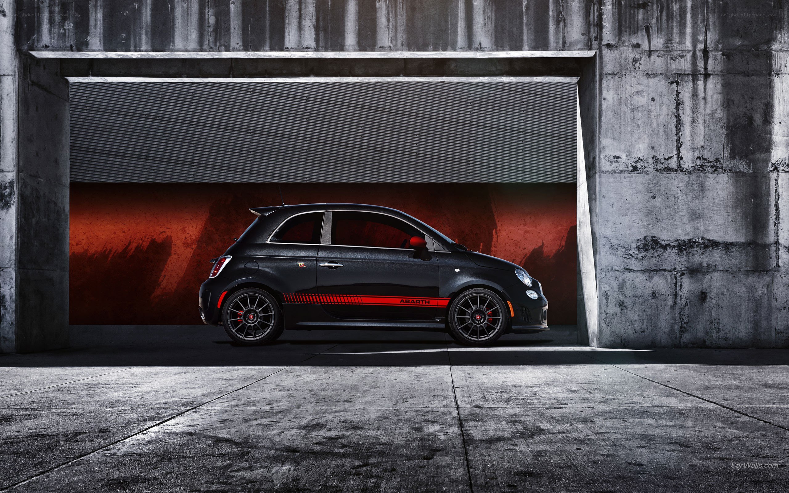 Black Abarth car in garage