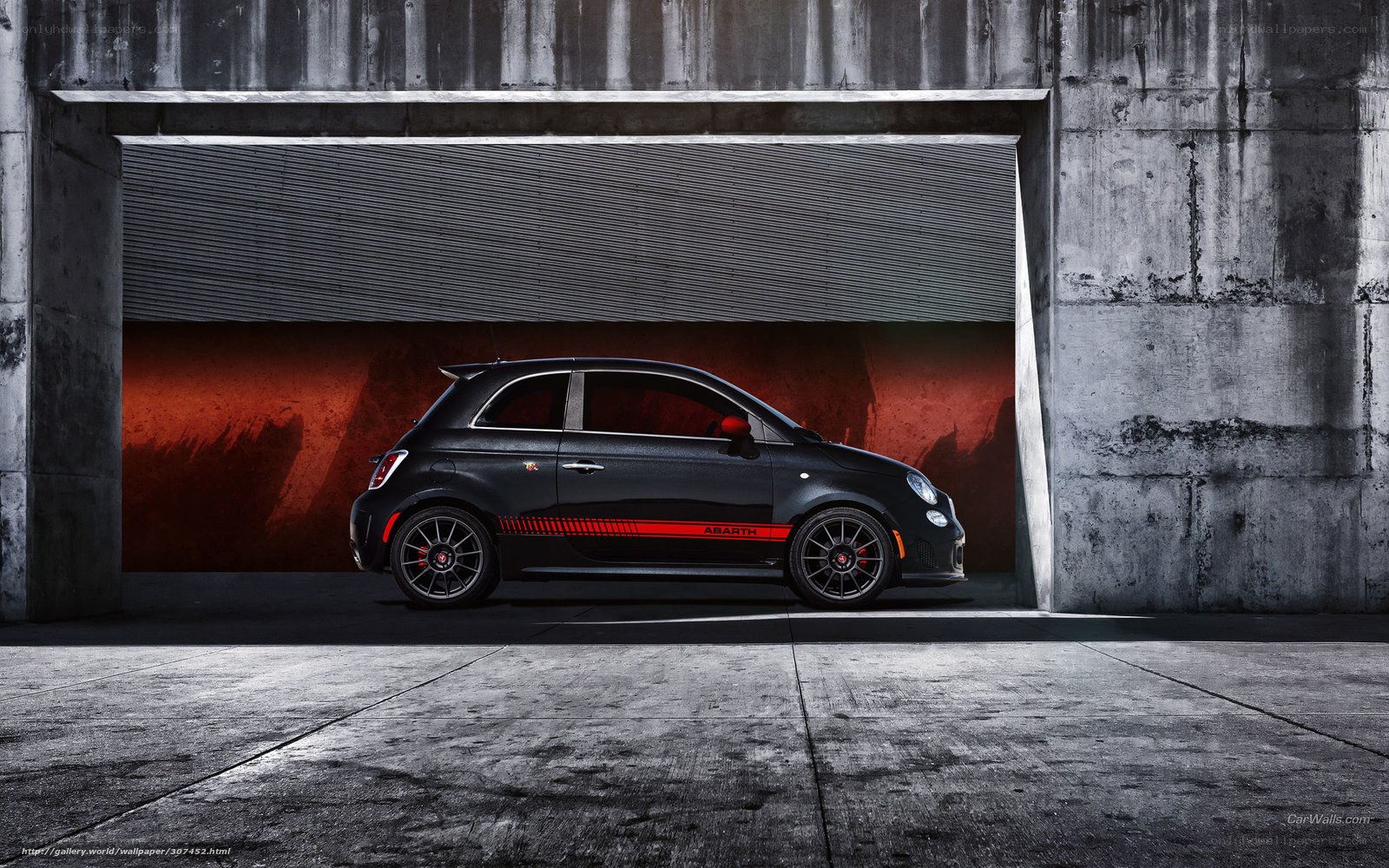 Black Abarth car in garage
