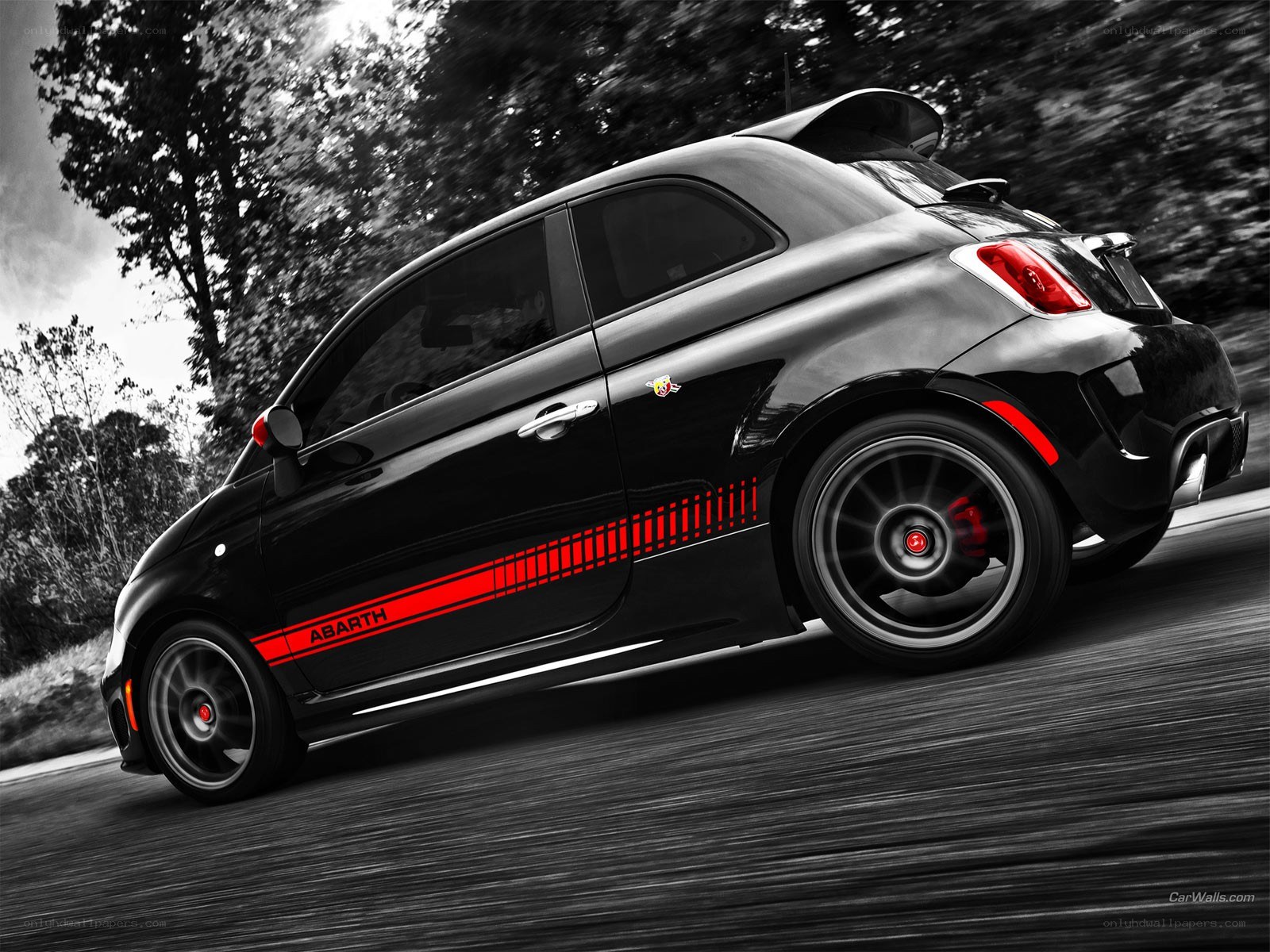 Black Abarth car in motion