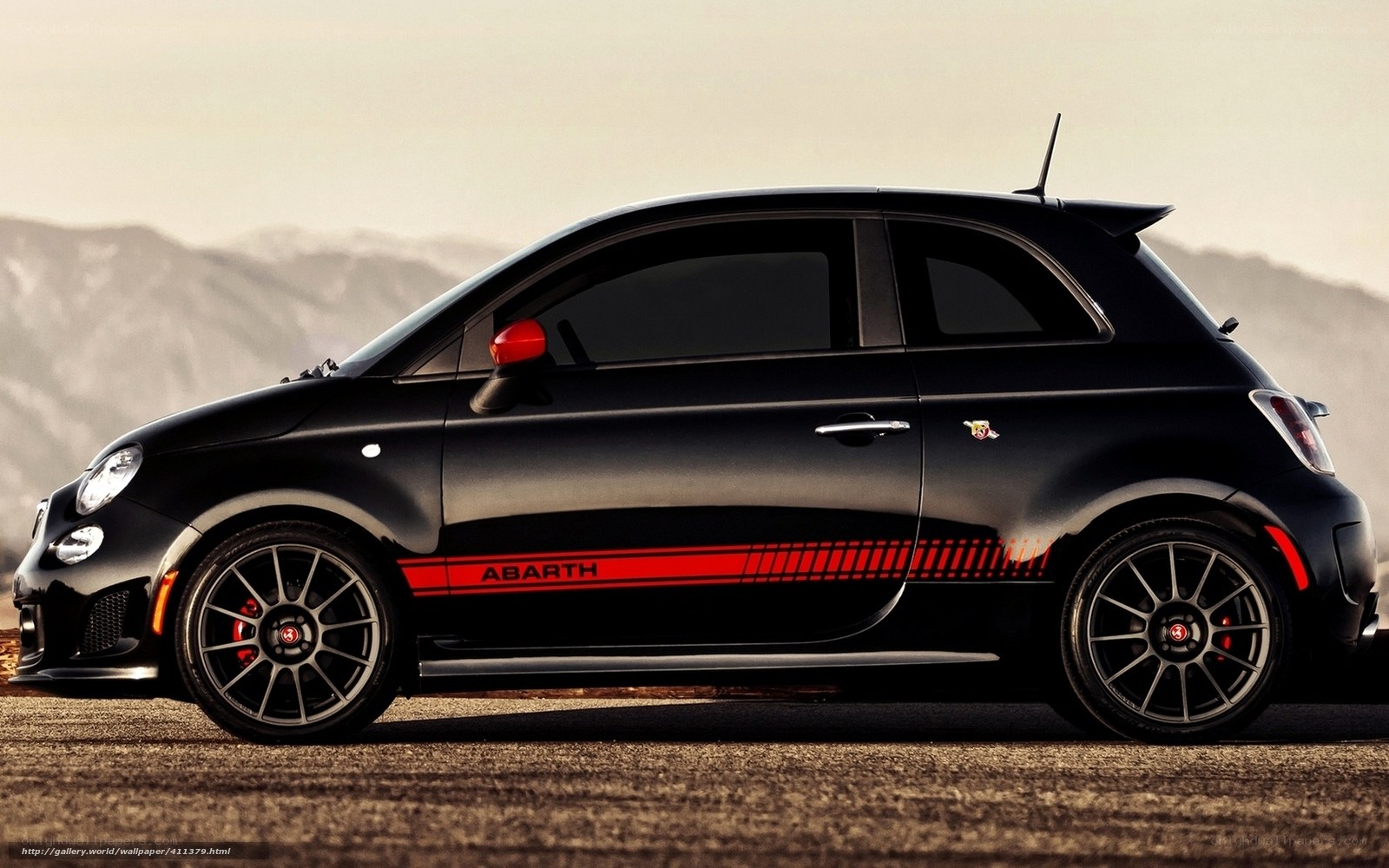 Black Abarth car on mountain road