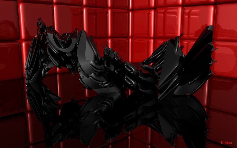 black abstract sculpture on red wall